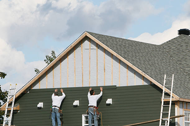 Professional Siding technician working in Longmont, CO